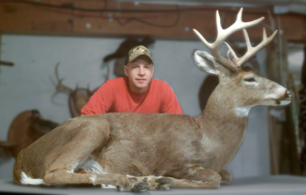 Ken posing with a full-size taxidermy deer